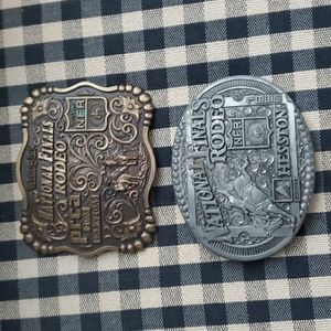 2 Collectible NFR belt buckles.